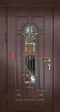 Темная железная дверь со стеклом и ковкой для частного дома ДСК-156 в Смоленске