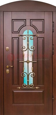 Арочная дверь цвета дуб со стеклом и ковкой ДСК-58 в Ростове-На-Дону