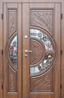 Уличная дверь в цвете Итальянский орех с виноритом и ковкой со стеклом ДВТ-147 в Котельниках